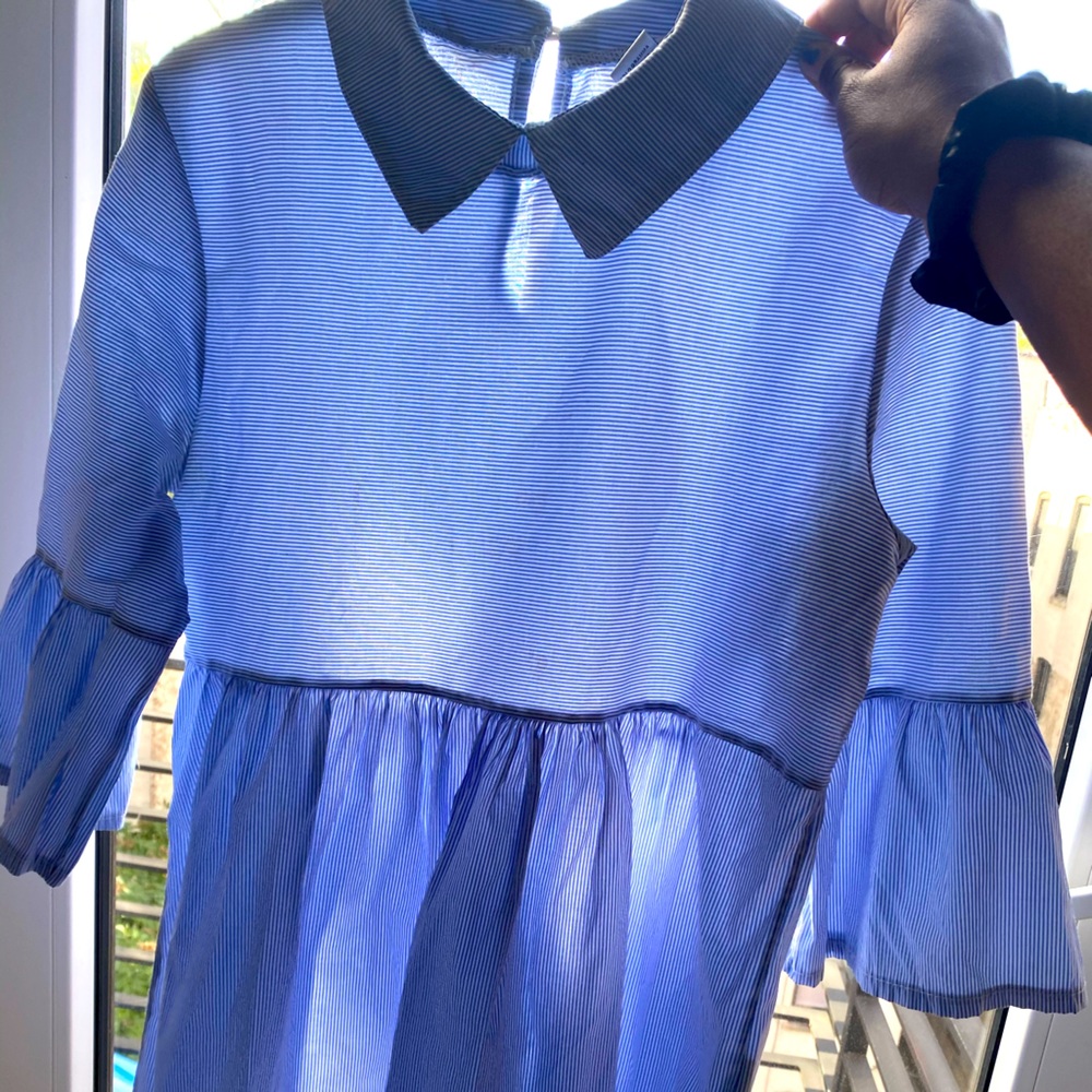 Beautiful blue collar shirt with flared sleeves